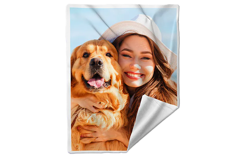 Close up of printerpix custom dog blanket with fleece fabric and photo of child and dog