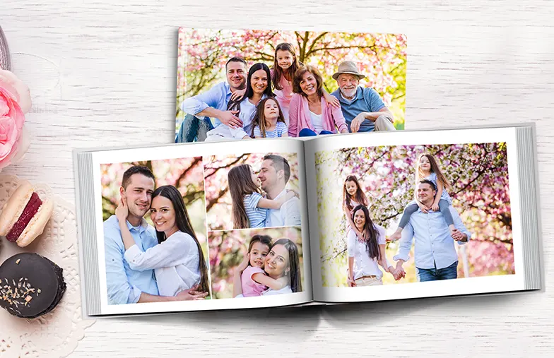 Pet and woman looking at personalised family photo book with custom design