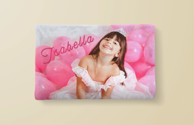 Folded custom mink touch blanket with photo collage of small holiday photos