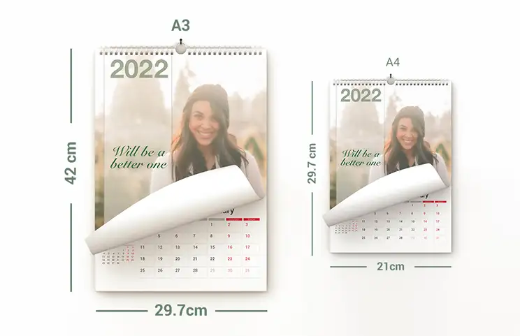 Dog photos on custom design photo calendar hung up on wall