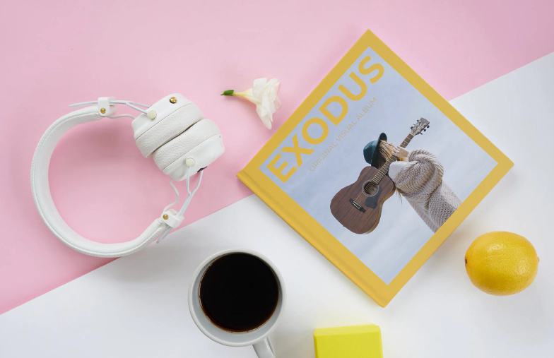 Two people looking at Printerpix custom photo book with wedding photos and bride